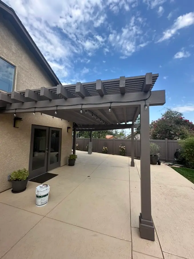Pergola rafters and beam detail against a clear sky in Leucadia, California
