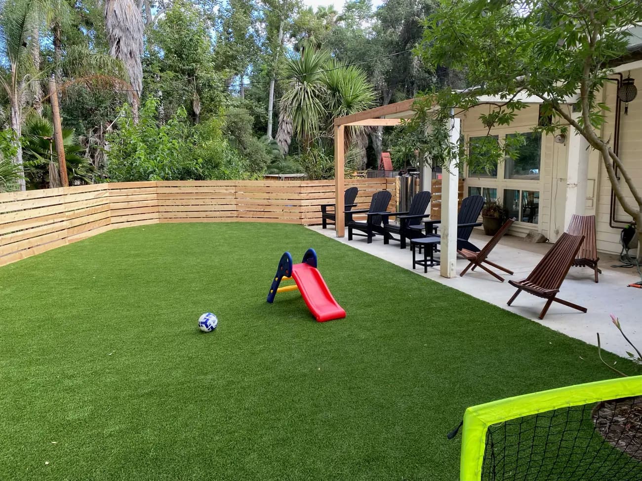 Finished Escondido backyard with turf, a new fence, and a covered patio