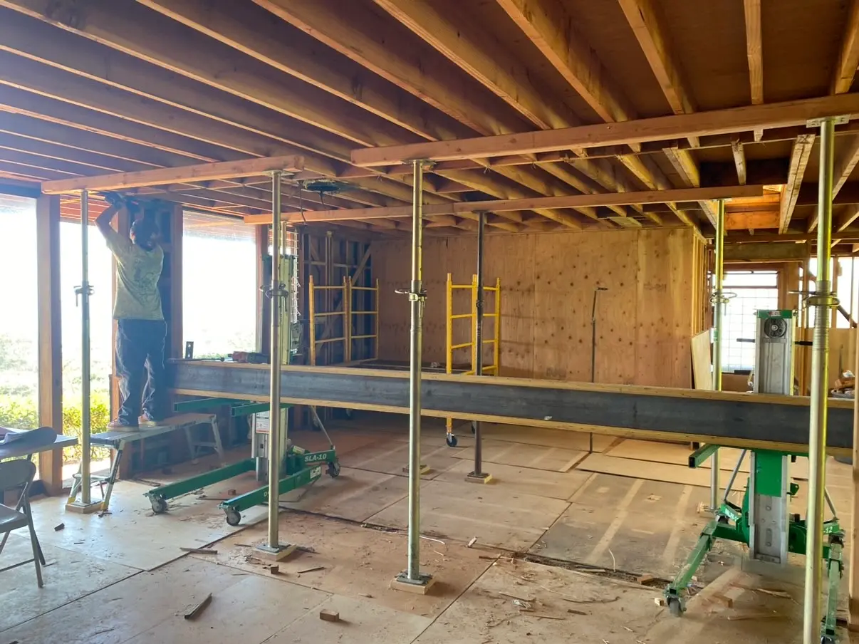 Interior opened to the framing with shoring posts holding the ceiling in La Jolla