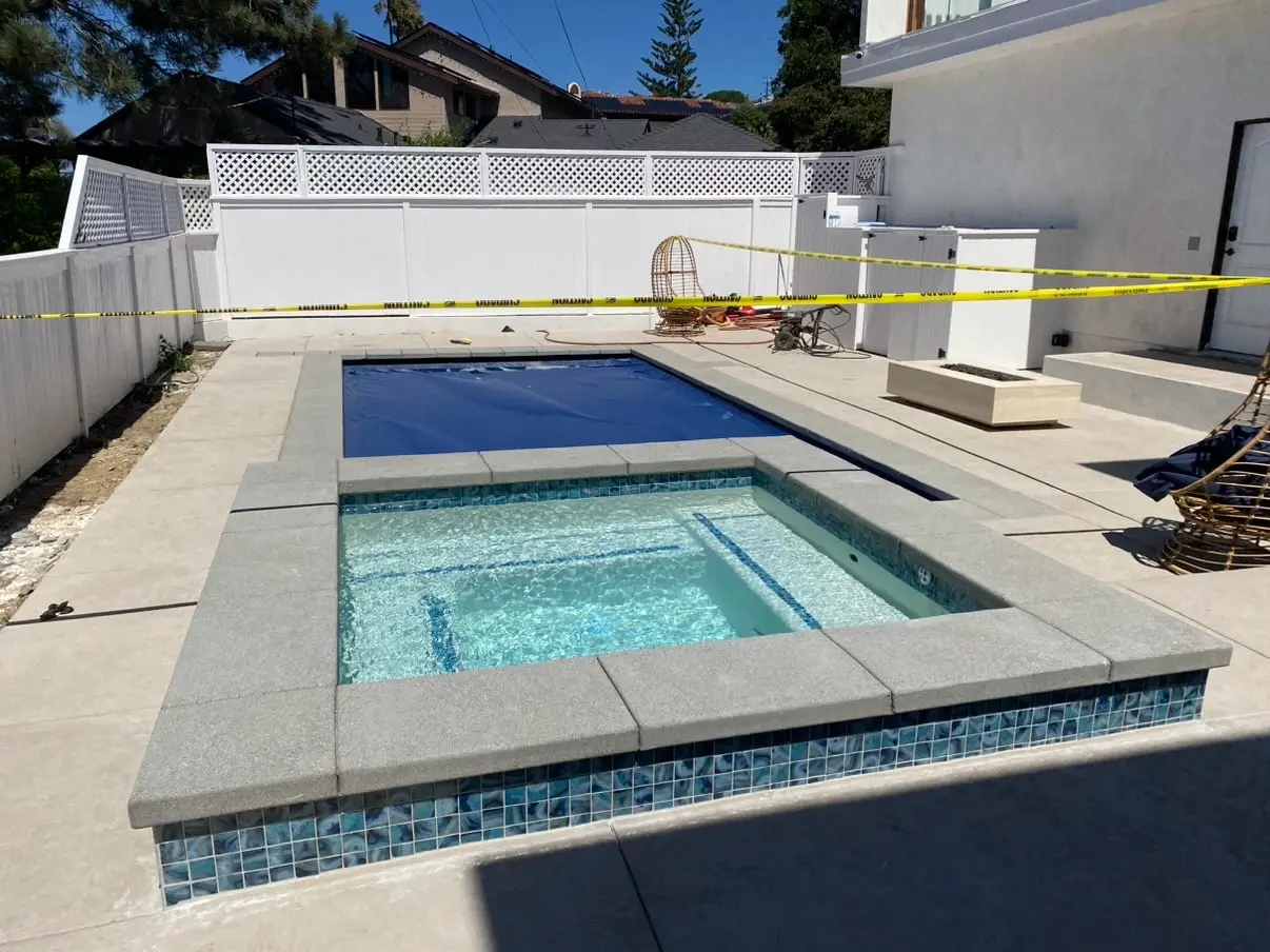 Pool and hardscape with a new outdoor kitchen alongside in Ocean Beach