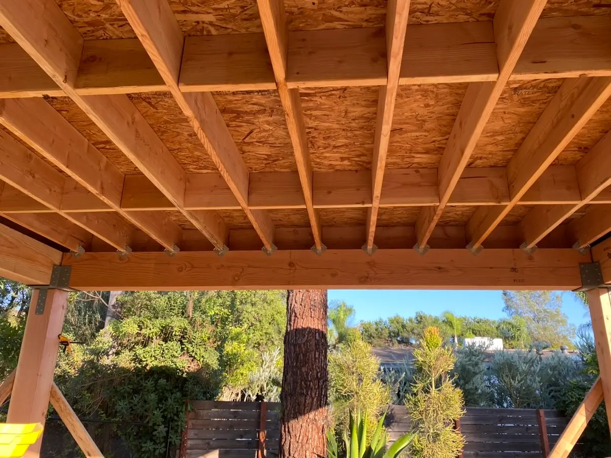 Cedar rafters and tongue-and-groove ceiling seen from underneath a Rancho Bernardo pavilion