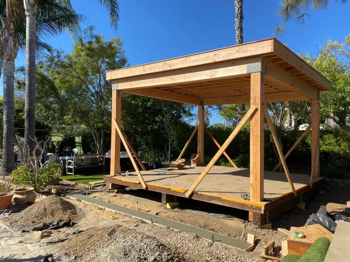 Pavilion posts and beams set square with temporary bracing in place