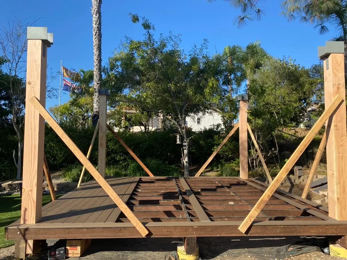 Pavilion and deck framing standing open against a Rancho Bernardo sky