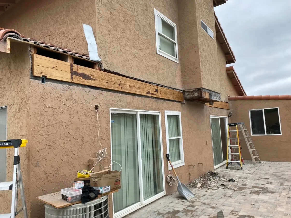 Exterior wall opened up for new doors and windows during a remodel