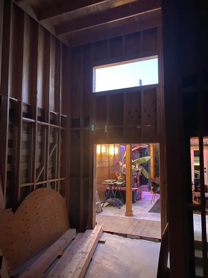 Finished modern exterior with new stucco and a black-framed clerestory window
