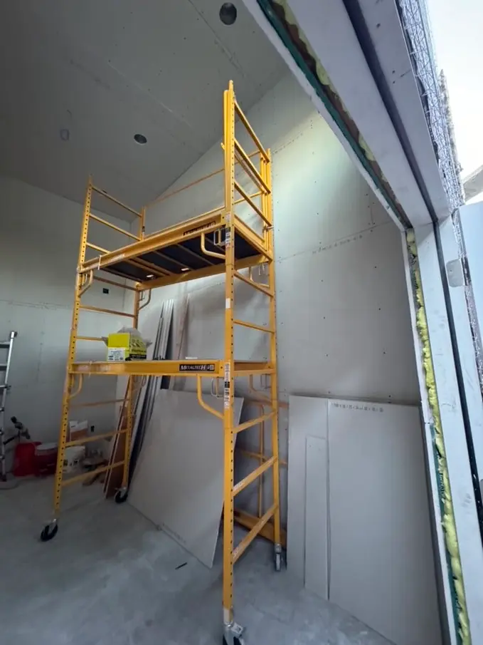 Historic garage stripped to the original framing before conversion