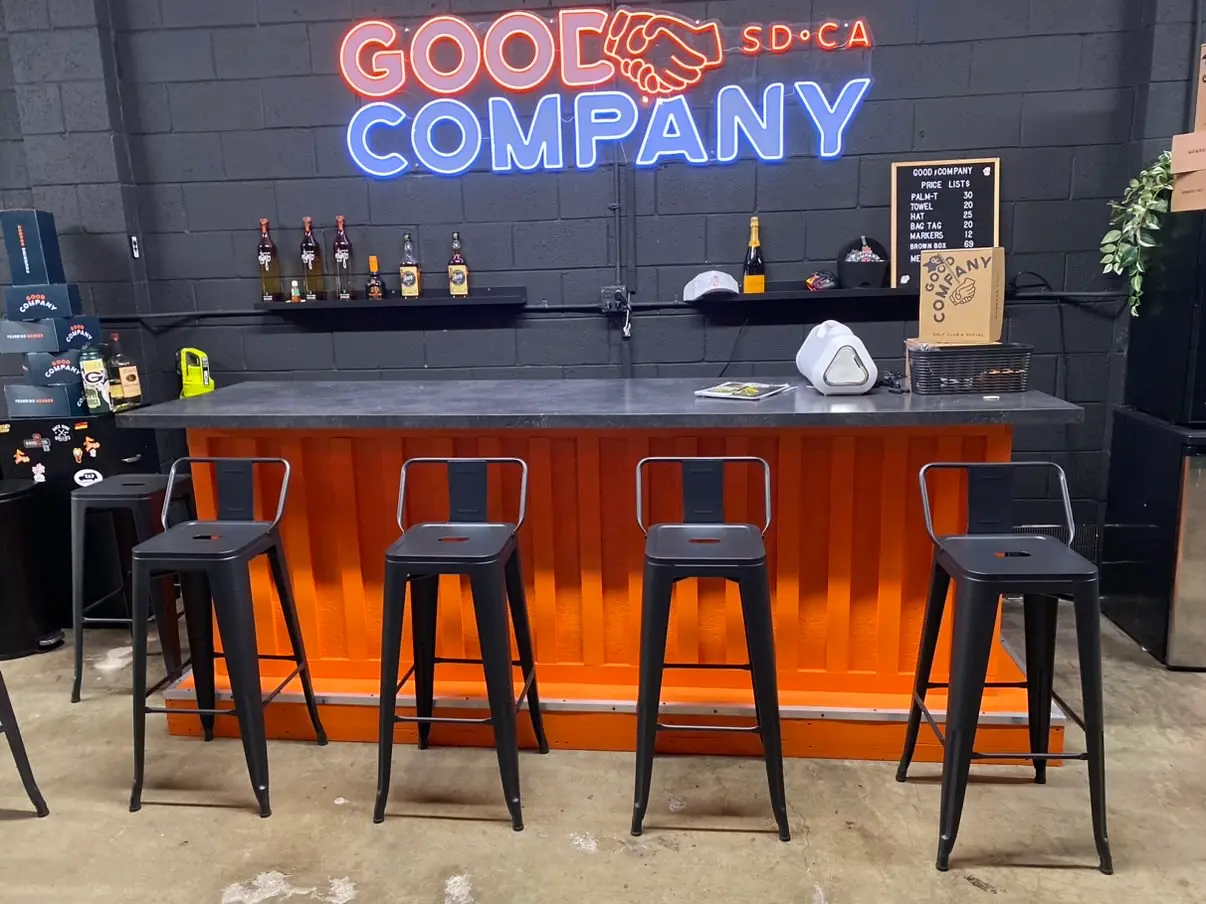 Custom slatted bar front and back bar millwork in a San Diego commercial space