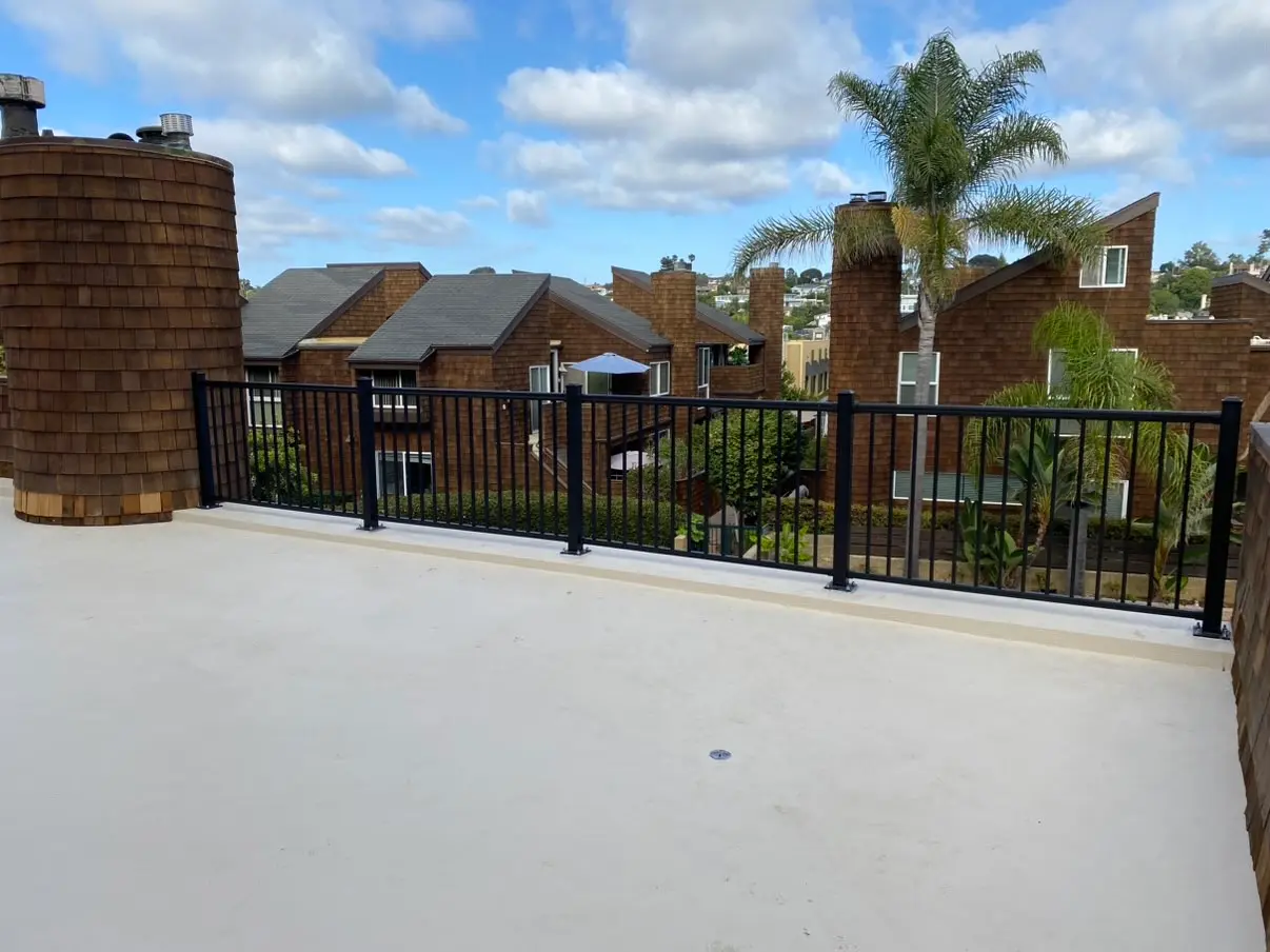 Black metal commercial railing installed along a Solana Beach deck