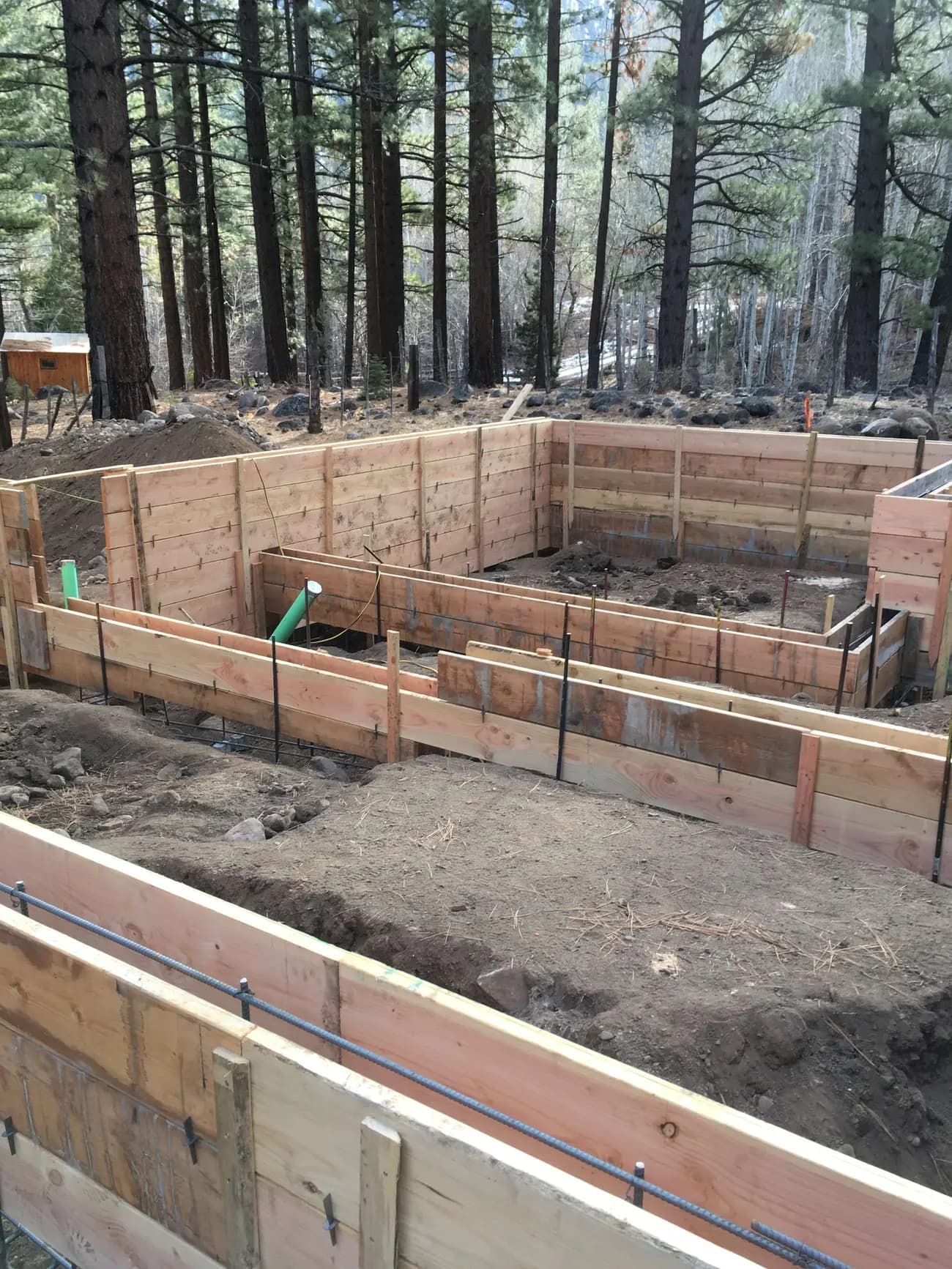 Concrete forms and rebar laid out for footings on a South Lake Tahoe build