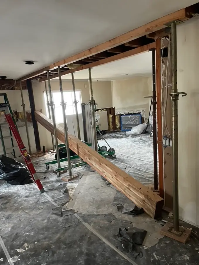 New beam installed and shored after a load-bearing wall was removed in a Vista home